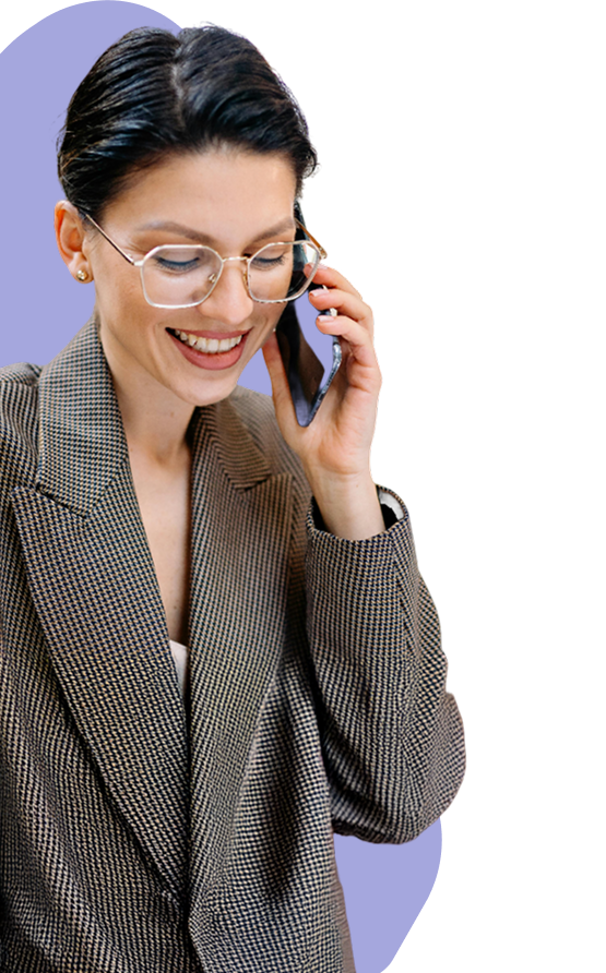 Woman with short hair, wearing a trendy suit, talking on the phone